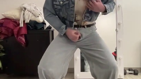 Sexy crossdresser in wide-leg palazzo jeans, sissy tee and denim jacket masturbates for you